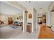 Bright hallway with tile floors leading to the living room and dining room at 1115 Lake Francis Dr, Apopka, FL 32712