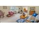 Comfortable living room with carpet, vintage furniture, and dining area in the background at 1115 Lake Francis Dr, Apopka, FL 32712