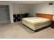 Spacious basement bedroom with a neutral carpet, desk and closet at 116 Oakmont Ln, New Smyrna Beach, FL 32168