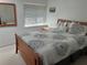 Comfortable bedroom with a large window and neutral decor providing a relaxing space at 116 Oakmont Ln, New Smyrna Beach, FL 32168
