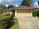 Charming home featuring a large two-car garage and well-manicured landscaping at 116 Oakmont Ln, New Smyrna Beach, FL 32168