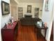 Cozy living room with warm hardwood floors, a fireplace, and comfortable seating at 116 Oakmont Ln, New Smyrna Beach, FL 32168