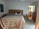 Bright main bedroom offering a calm color palette and hardwood floors at 116 Oakmont Ln, New Smyrna Beach, FL 32168
