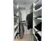 Spacious walk-in closet with custom shelving and ample storage space for clothes and accessories at 116 Oakmont Ln, New Smyrna Beach, FL 32168