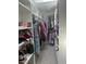 Large walk-in closet with lots of room to move around and plenty of custom shelving for storage at 116 Oakmont Ln, New Smyrna Beach, FL 32168