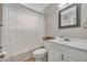 Fresh bathroom with white vanity, framed mirror, patterned shower curtain, and standard fixtures, a practical and clean space at 1161 Dot Dr, Altamonte Springs, FL 32714