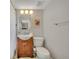 Cozy bathroom featuring a wood vanity, white sink, and decorative artwork, offering a functional and stylish space at 1161 Dot Dr, Altamonte Springs, FL 32714