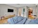 Comfortable bedroom featuring a large TV and access to a walk-in closet at 1161 Dot Dr, Altamonte Springs, FL 32714