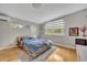 Serene bedroom with natural light, wood floors, and minimalist decor at 1161 Dot Dr, Altamonte Springs, FL 32714