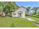 Charming home with an orange front door, neutral siding, and a covered carport at 1161 Dot Dr, Altamonte Springs, FL 32714