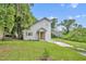 Charming home with an orange front door, neutral siding, and a covered carport at 1161 Dot Dr, Altamonte Springs, FL 32714