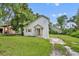 Charming home with an orange front door, neutral siding, and a covered carport at 1161 Dot Dr, Altamonte Springs, FL 32714