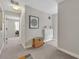 Hallway with neutral walls, plush carpet, and storage options, creating a clean and organized transition space at 1161 Dot Dr, Altamonte Springs, FL 32714