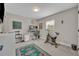 Functional home office with exercise equipment, carpeted floors, and natural light at 1161 Dot Dr, Altamonte Springs, FL 32714