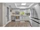 Bright kitchen featuring white cabinets, stainless steel appliances, and a view from the window at 1161 Dot Dr, Altamonte Springs, FL 32714