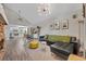 Open-concept living room leading to a kitchen with modern appliances and a dining area at 1161 Dot Dr, Altamonte Springs, FL 32714