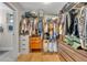 Spacious walk-in closet with ample storage, shelving, and natural wood finishes at 1161 Dot Dr, Altamonte Springs, FL 32714