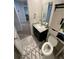 Cozy bathroom featuring a vanity with a mirror, a toilet and decorative rug at 1193 Catskill Dr, Haines City, FL 33844