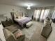 Comfortable bedroom with stylish furniture, soft lighting, and cozy decor at 1193 Catskill Dr, Haines City, FL 33844