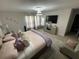 Relaxing bedroom features stylish furnishings, ample natural light, and a cozy atmosphere at 1193 Catskill Dr, Haines City, FL 33844