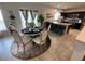 Elegant dining area featuring a round table and chairs next to the kitchen at 1193 Catskill Dr, Haines City, FL 33844