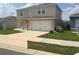 Well-maintained home with an attached garage and a beautifully landscaped front yard at 1193 Catskill Dr, Haines City, FL 33844