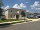 Lovely two-story home featuring a spacious driveway and a beautifully landscaped front yard at 1193 Catskill Dr, Haines City, FL 33844