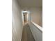 Hallway with clean, neutral colors and white doors and trim at 1193 Catskill Dr, Haines City, FL 33844
