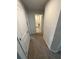 Hallway leading to bathroom featuring neutral walls and carpet at 1193 Catskill Dr, Haines City, FL 33844