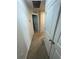 Hallway with clean, neutral colors and white doors and trim at 1193 Catskill Dr, Haines City, FL 33844