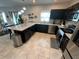 Modern kitchen with stainless steel appliances and dark cabinetry at 1193 Catskill Dr, Haines City, FL 33844