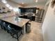 Spacious kitchen featuring a breakfast bar, stainless steel appliances, and modern finishes at 1193 Catskill Dr, Haines City, FL 33844