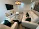 Inviting living room featuring plush sofas, a modern coffee table, and stylish decor at 1193 Catskill Dr, Haines City, FL 33844