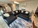 Comfortable living area with a large, luxurious sectional sofa and stylish decor at 1193 Catskill Dr, Haines City, FL 33844