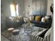 Beautifully decorated living room with stylish sofas, a glass coffee table, and elegant accessories at 1193 Catskill Dr, Haines City, FL 33844
