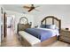 Bedroom with hardwood floors, a ceiling fan, and a comfortable bed at 127 Oak Ln, Ormond Beach, FL 32174