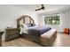 Bedroom with hardwood floors, ceiling fan, and a bright window at 127 Oak Ln, Ormond Beach, FL 32174