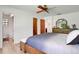Bedroom with hardwood floors, a ceiling fan, and an ensuite bath at 127 Oak Ln, Ormond Beach, FL 32174