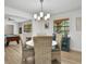 Cozy dining area with wicker chairs, and a view to the game room at 127 Oak Ln, Ormond Beach, FL 32174