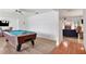 Spacious game room with a pool table, tile floors, and an open view to the living room at 127 Oak Ln, Ormond Beach, FL 32174