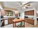 Traditional kitchen with wood cabinets, a movable island, and appliances at 127 Oak Ln, Ormond Beach, FL 32174