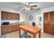 Traditional kitchen with wood cabinets, a movable island, and view to dining areas at 127 Oak Ln, Ormond Beach, FL 32174