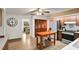 Traditional kitchen with wood cabinets, a movable island, and dining room view at 127 Oak Ln, Ormond Beach, FL 32174