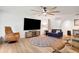 Bright and airy living room with modern furniture, a ceiling fan, and wood floors at 127 Oak Ln, Ormond Beach, FL 32174