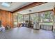 Relaxing screened-in porch with a view of the lush backyard at 127 Oak Ln, Ormond Beach, FL 32174