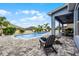Inviting backyard pool and patio area with outdoor seating and lush palm trees at 13194 Magnolia Valley Dr, Clermont, FL 34711