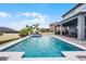Backyard oasis with a pool, covered patio, and lush green landscaping at 13194 Magnolia Valley Dr, Clermont, FL 34711