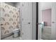 Bathroom featuring a shower with rainbow curtain, neutral paint, and access to the adjacent bedroom at 13194 Magnolia Valley Dr, Clermont, FL 34711