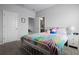 bedroom with plush carpet, neutral paint, a bed with colorful bedding, and en suite bathroom at 13194 Magnolia Valley Dr, Clermont, FL 34711