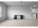 Neutral bonus room featuring plush carpet, a ceiling fan, and a modern storage unit at 13194 Magnolia Valley Dr, Clermont, FL 34711